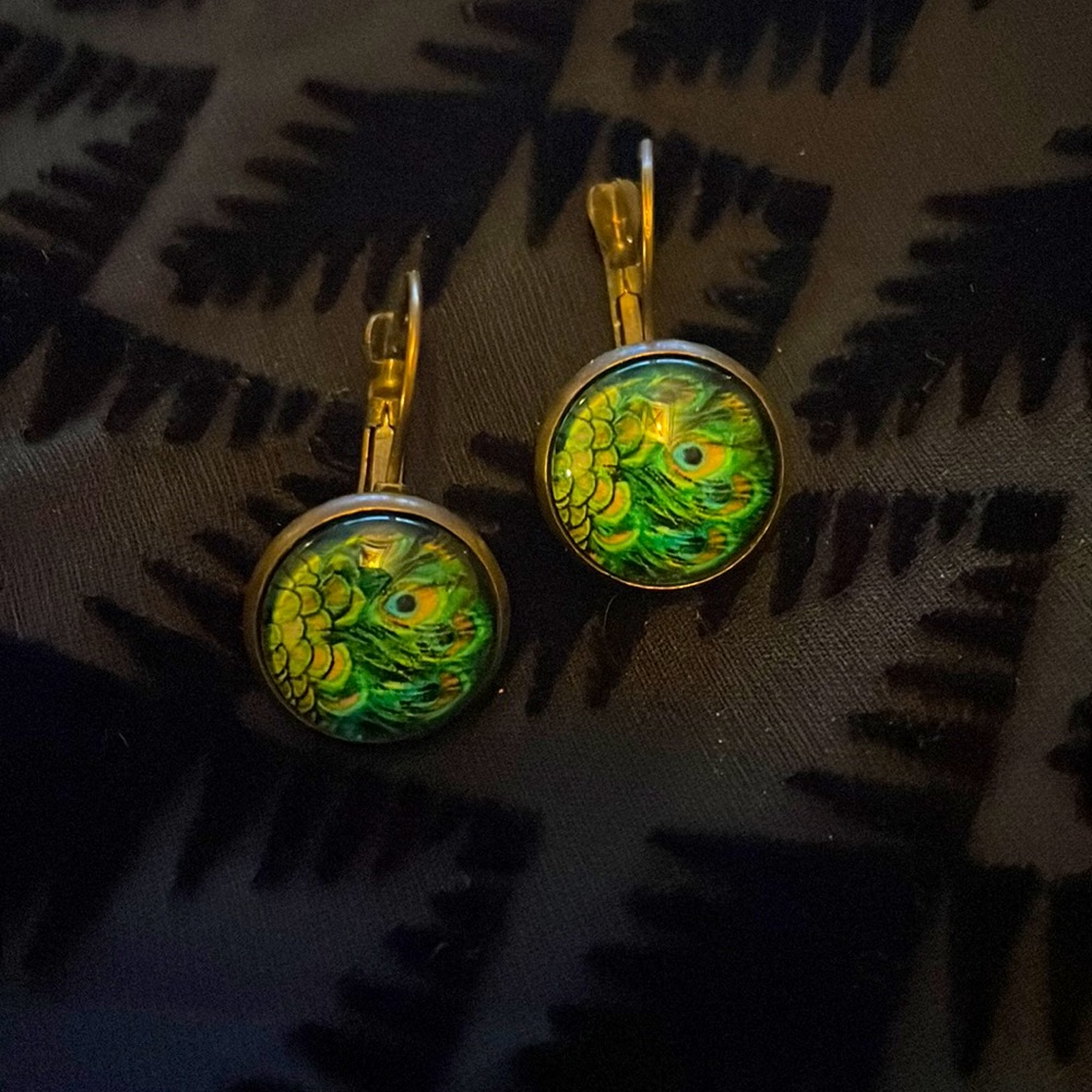 Beautiful metal and glass Peacock lever back earrings with antique finish.